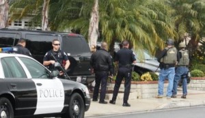 US Marshalls, and members of the Irvine Police Department serve search warrant at the home of Chris Dorner on Friday in La Palma.  Randy Economy Photo