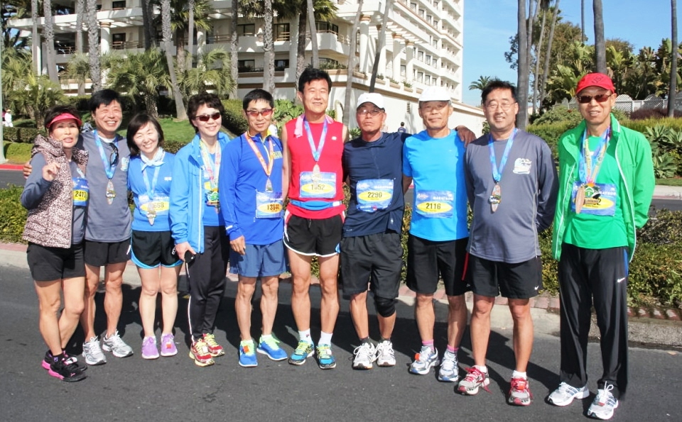 Members of the Cerritos Easy Runners Club at the Boston Marathon prior to the race.  Photo Special to Los Cerritos Community Newspaper from Club member James Kang.