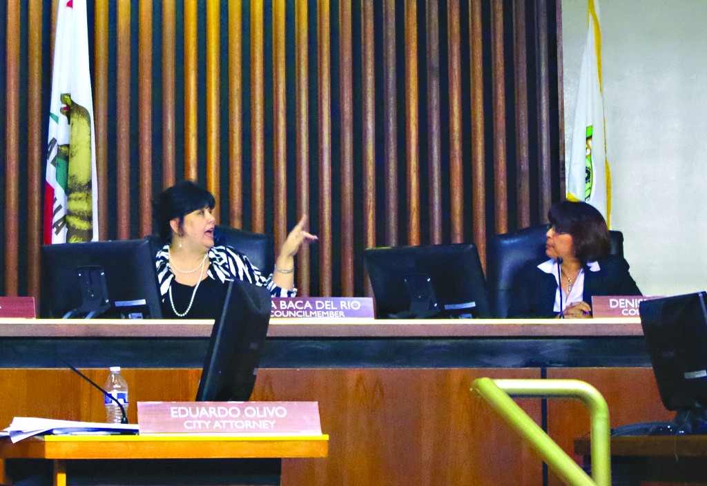 Commerce City Council Member Tina Baca Del Rio flashes hand gesture to rival council member Denise Robles during a heated meeting this past Tuesday. Kristin Grafft