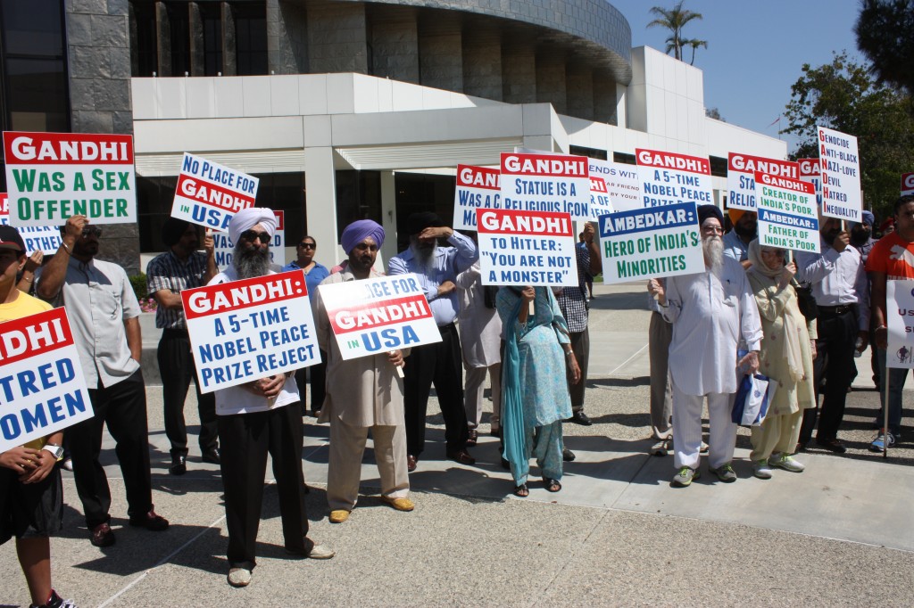 Protesters gather outside of Cerritos City Hall to speak out against a statue of Gandhi that is placed nearby at Carmenita Road and Alondra Boulevard. Between 75 and 100 people attended the demonstration.  Randy Economy Photo