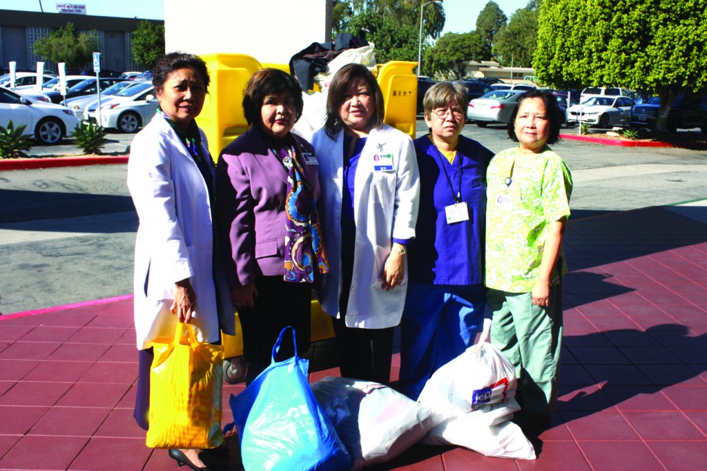 Nurses from Tri-City Medical in Hawaiian Gardens gathered box loads of clothes, shoes, cash and supplies that are all being sent to help victims of the Typhoon in the Philippines. Seen in the photo are Helen Duca, Lita Caguin, Juliet Miranda, JD Windsor and Lila Mappo. Randy Economy Photo