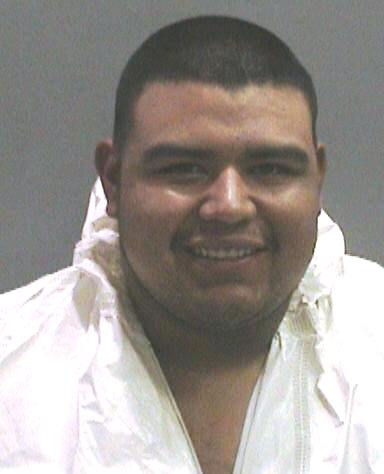 Suspect Perez Munoz sports a smile in his  booking photo on murder charges in Orange County.  