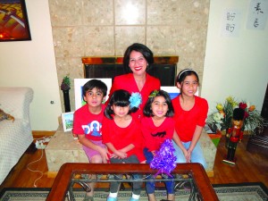 Dr. Irella Perez celebrates the Christmas holiday with her four children at their Whittier home.  Tammye McDuff Photo.