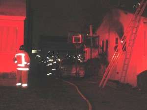 Fire fighters respond to explosion and house fire on Cornuta Avenue in Bellflower. Tammye McDuff Photo