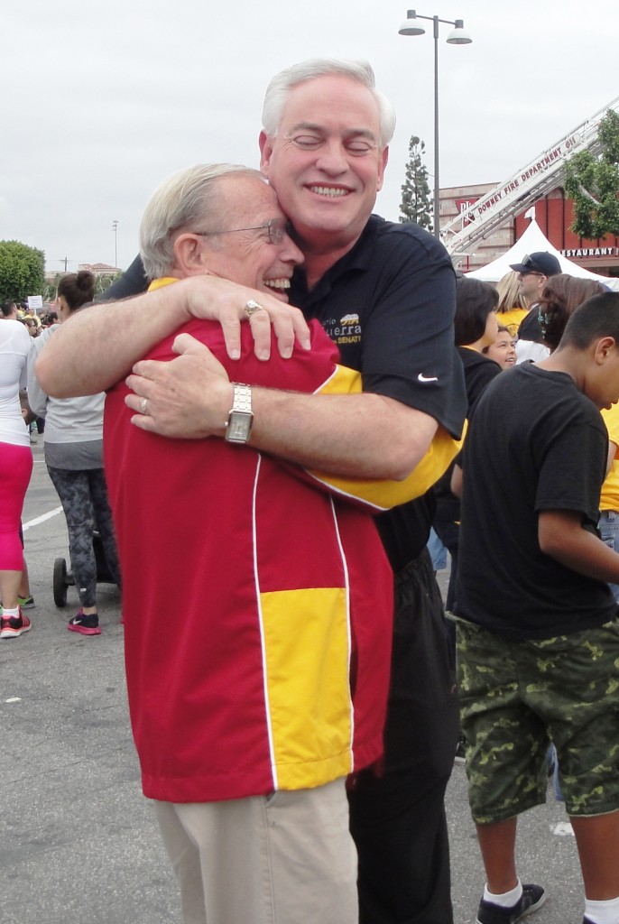 : Downey City Councilman Mario Guerra is “all hugs” at the annual ARC Walk in Downey.  Tammye McDuff Photo
